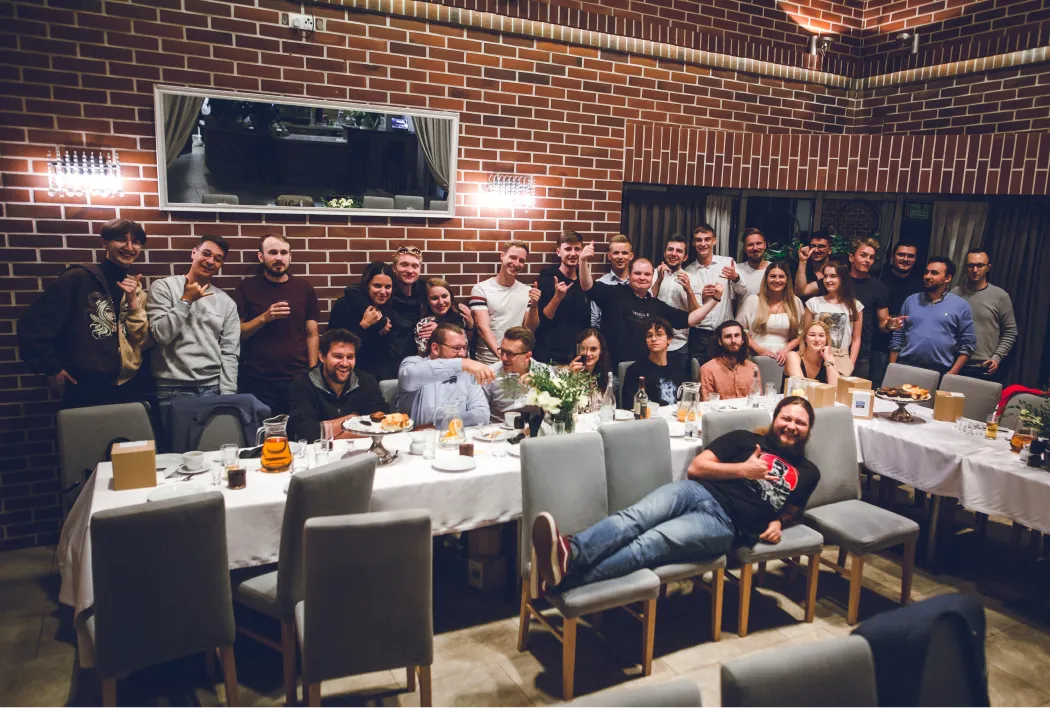 Group of people in the company posing for a photo.